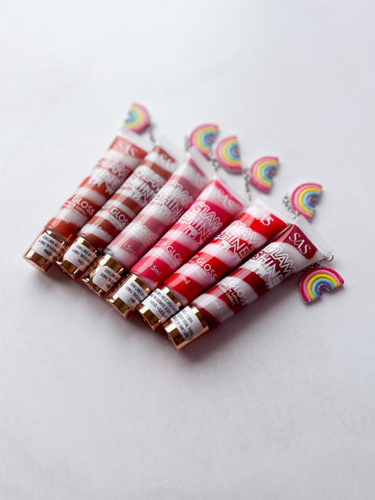 SAS - PACK DE 6: Gloss GLAM SHINE aroma Chocolate con charm ($1.665 c/u)
