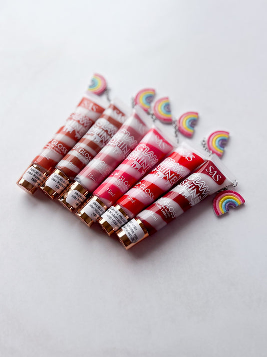 SAS - PACK DE 6: Gloss GLAM SHINE aroma Chocolate con charm ($1.665 c/u)